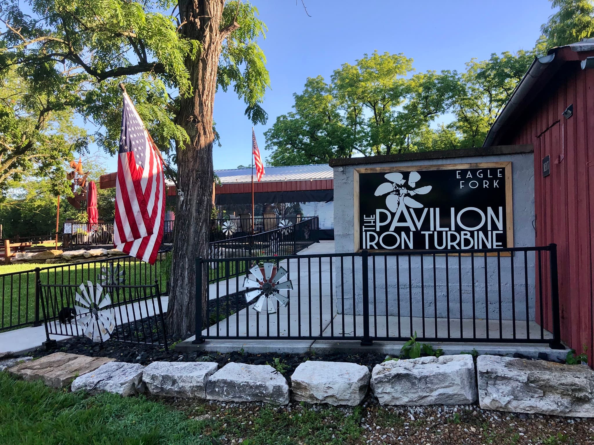 The Pavilion at Iron Turbine entrance sign along the front fence.